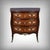 An elegant Parisian commode in the Transition style, crafted from marquetry, opening with three drawers in a curved front....