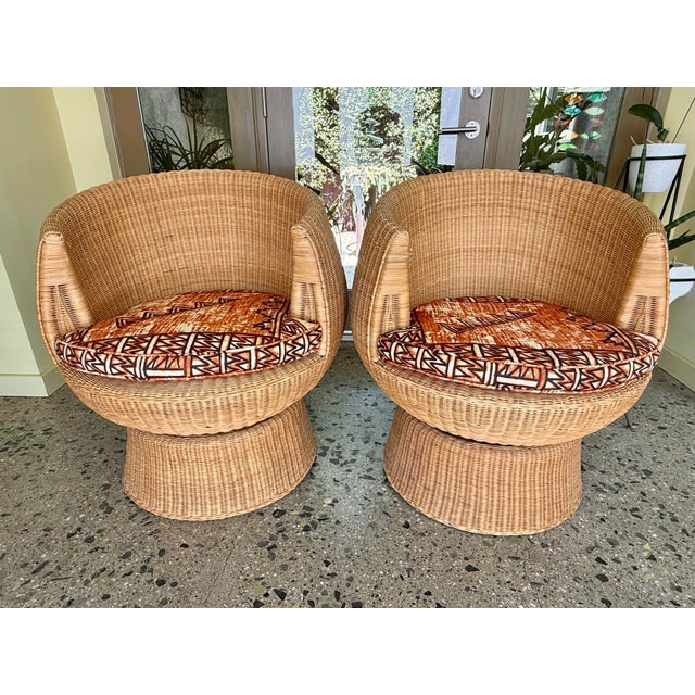 An amazing set of wicker pod chairs with swivel base. In the style of Eero Aarnio design, these chairs will make a focal...