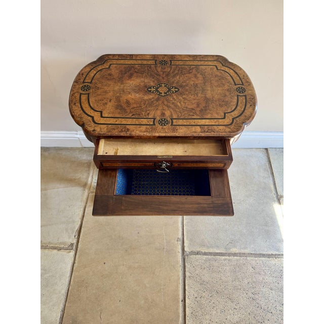 Quality antique Victorian inlaid burr walnut work table, having a quality inlaid burr walnut top above a fitted drawer and...