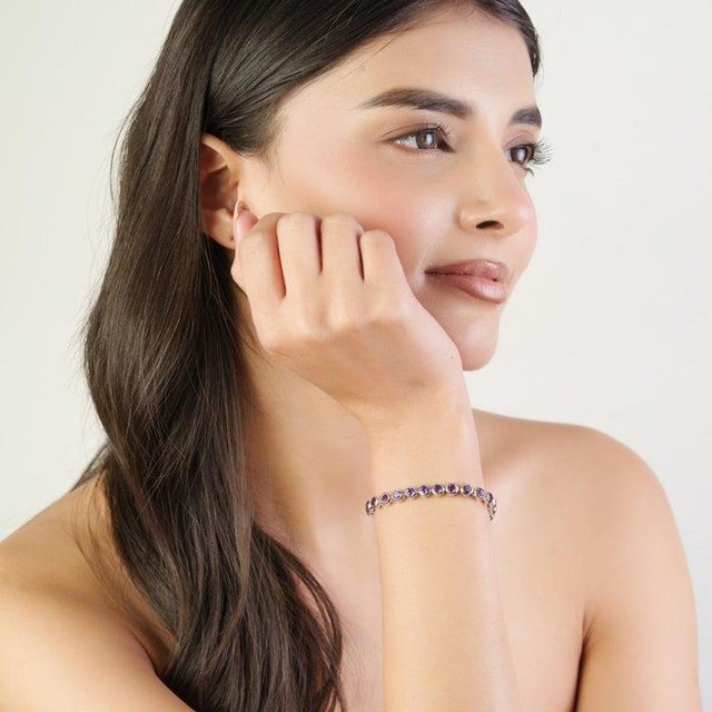 This refined tennis bracelet is crafted in 925 sterling silver and features 44 natural Smoky Topaz gemstones, each...