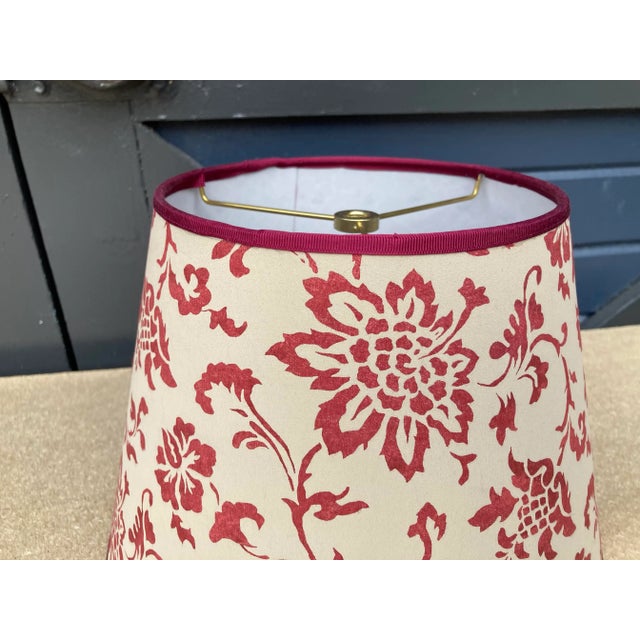 A lampshade handmade made from a vintage Brunschwig & Fils printed cotton. Measurements: top 7” bottom 11” side 8”
