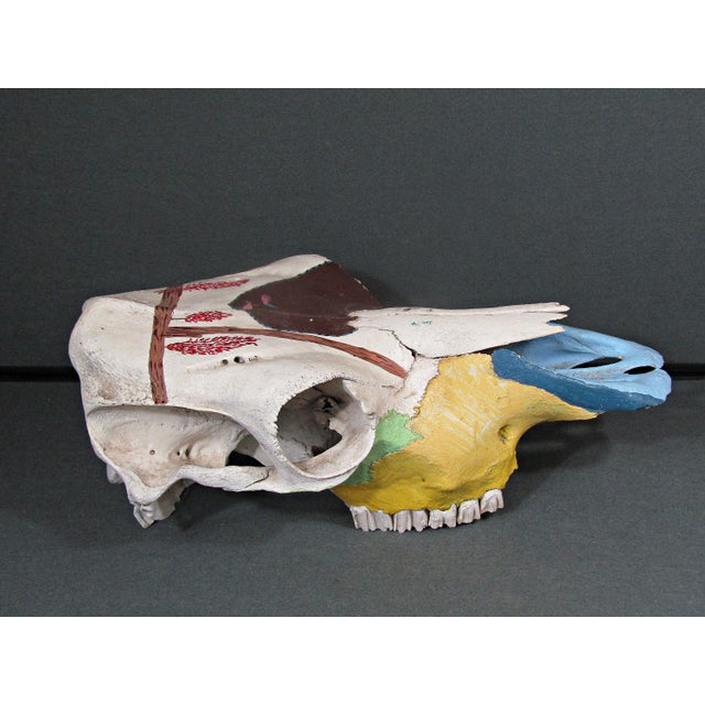 A wonderfully expressive hand-painted bovine skull with a sculptural presence and an easy Southwestern-meets-folk-art...