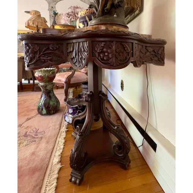 Beautiful center table, commonly referred to as a turtle top table . It’s has highly detailed fruit and floral deep relief...