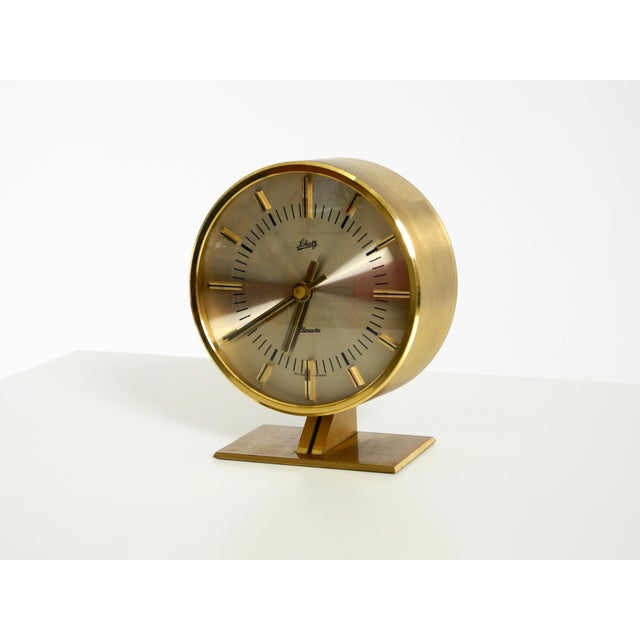 Beautiful, rare, round, original 1960s battery-operated brass table clock by Schatz. The original clockwork is still...