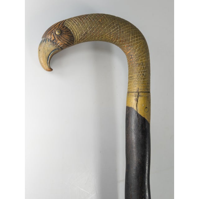 We are selling this great American folk art cane. This cane has great form of a bird or Eagle. The handle is polychrome...