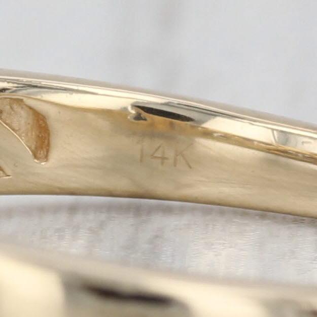 Gemstone Information: - Natural Diamonds - Total Carats - 0.56ctw (0.23ct center, 0.15ctw halo, 0.18ctw band) Cut - Round...