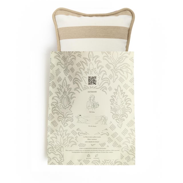 Bring a fresh Mediterranean touch to your outdoor spaces with this elegant striped cushion. Handcrafted in Italy from...