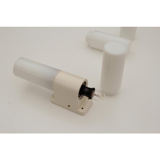 Set of two rare Bauhaus wall lights made in Germany in the 1920s. White opal glass on ceramic fitting and Bakelite lamp...