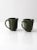 This is a pair of vintage studio pottery mugs. Signed by the artist, the hand-crafted mugs have a beautiful olive green,...