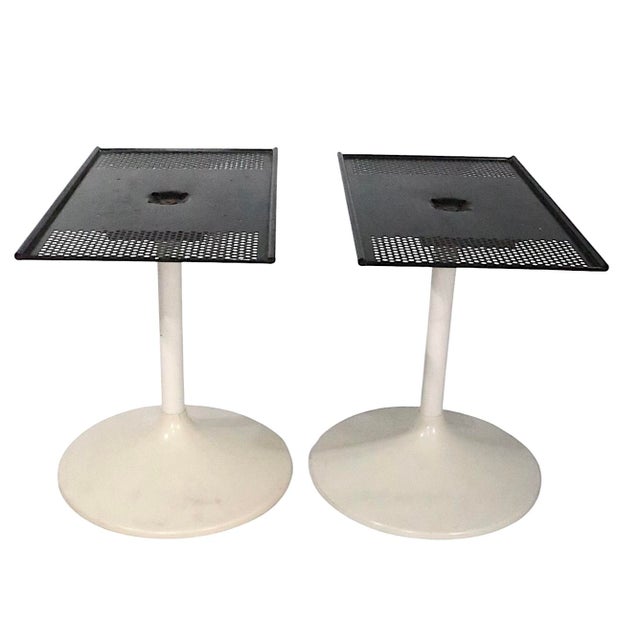 Groovy pair of Saarinen style pedestal base tables, having plastic and metal bases, with perforated metal black metal...