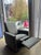 Monte Design well-proportioned reclining glider in a soft charcoal upholstery. A clean, architectural silhouette with a...