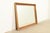 A gorgeous French Rococo style large wall mirror with ornate carved gold gilt wood frame In the manner of Romweber USA,...