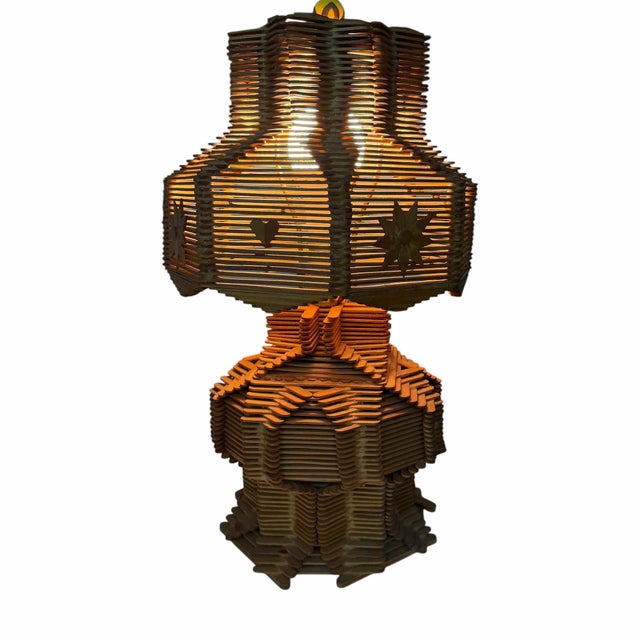 Vintage mid century handmade folk, tramp art, pinwheel and hearts design popsicle stick lamp. Measures 11” diameter x...