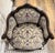 Early 20th Century petite bergère chair with silver-grey needlepoint upholstery, deep red and gold accents and matching...