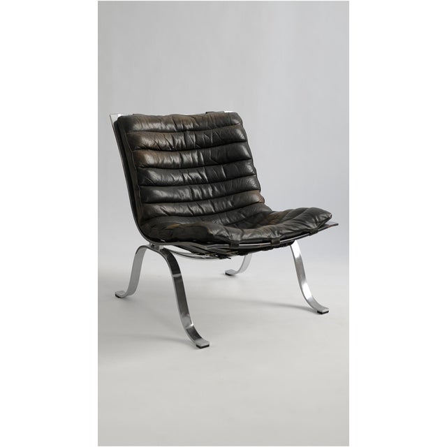 A handsome example of Swedish modern design, the "Ari" lounge chair was designed by Arne Norell and produced by Norell...