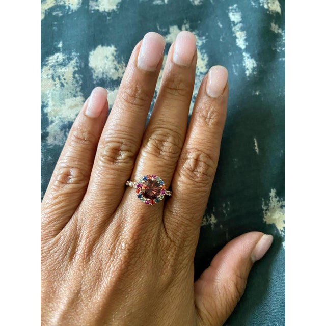 2.33 Carat Tourmaline Sapphire Rose Gold Cocktail Ring This ring has a 1.43 carat Round Cut Tourmaline that is set in the...