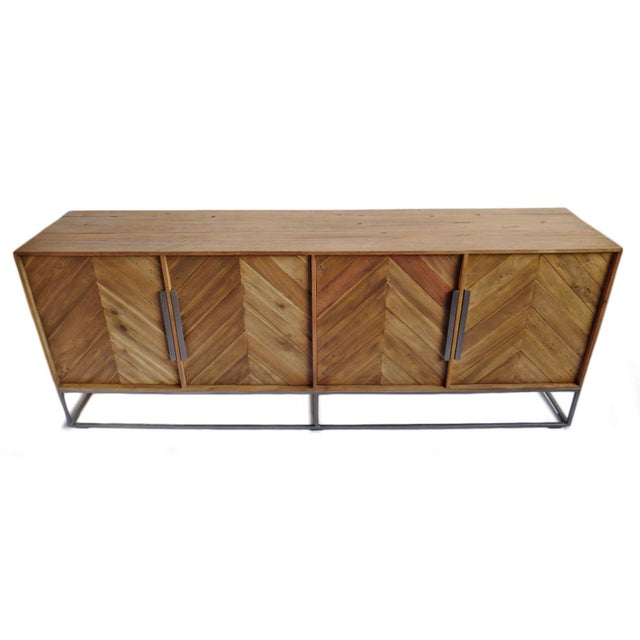Crafted from richly patinated salvaged wood, sideboard showcases a striking chevron facade that highlights the natural...