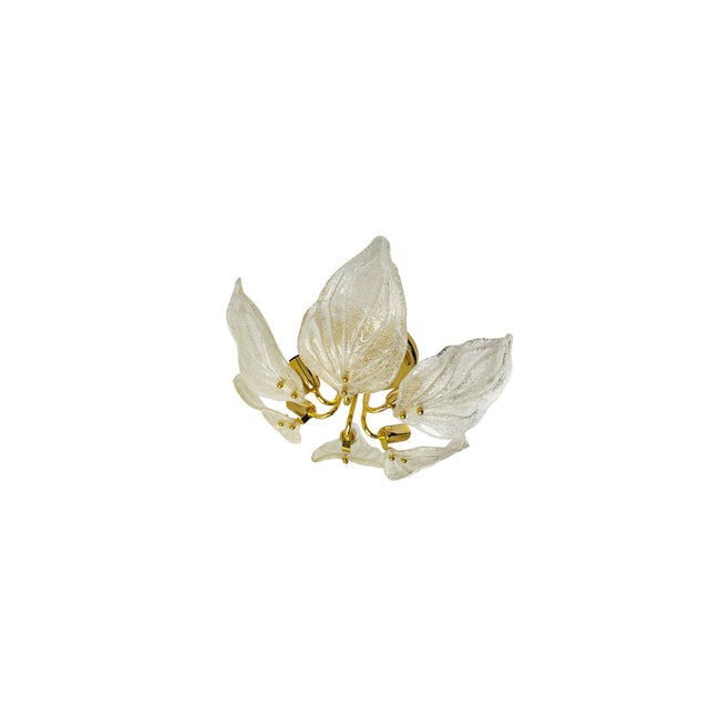 Elegant flush mount with thick Murano Glass leaves on a gilded brass frame. This chandelier illuminates beautifully and...