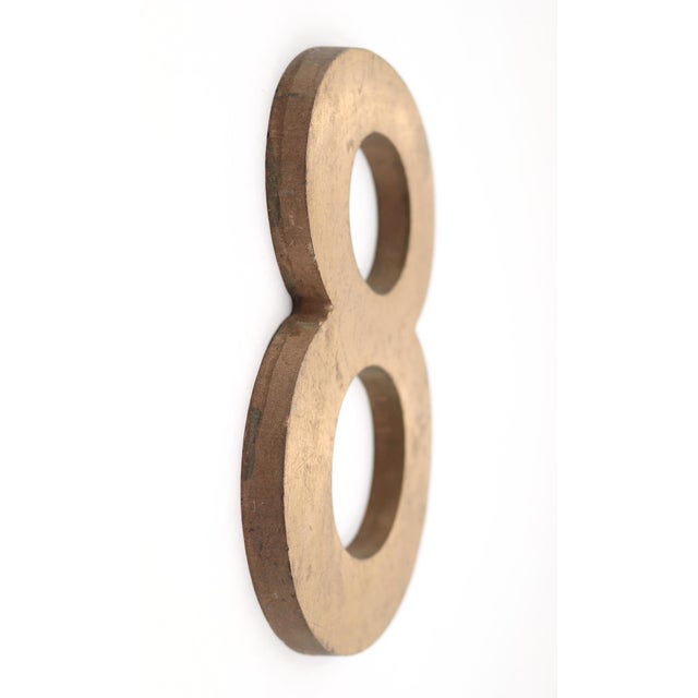 Vintage block style number 8 made of brass with a brushed finish. The piece has a hollow back. Good condition with surface...