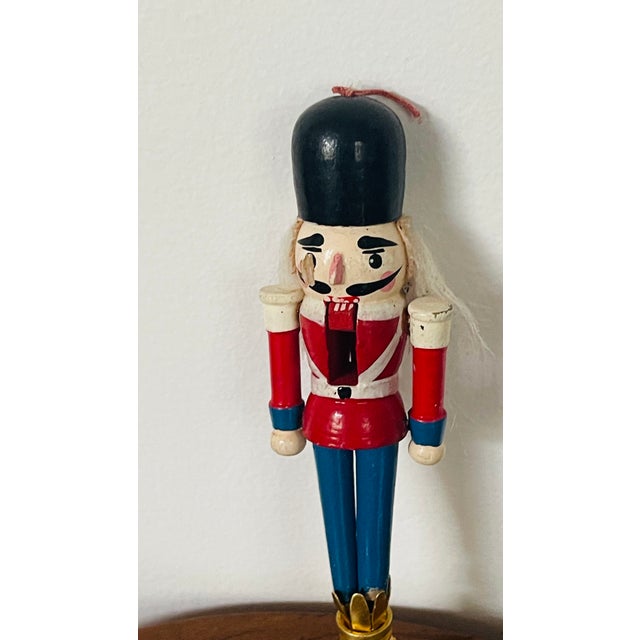 Vintage polychrome wood nutcracker lamp finial.