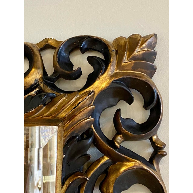 Handsome carved mirror from late 1800's france. Original condition with modern bevelled mirror.