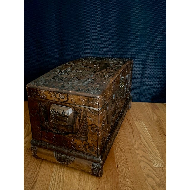 This hand-carved footed wooden chest with hand-carved wooden carry handles is great for storing linens or other treasured...