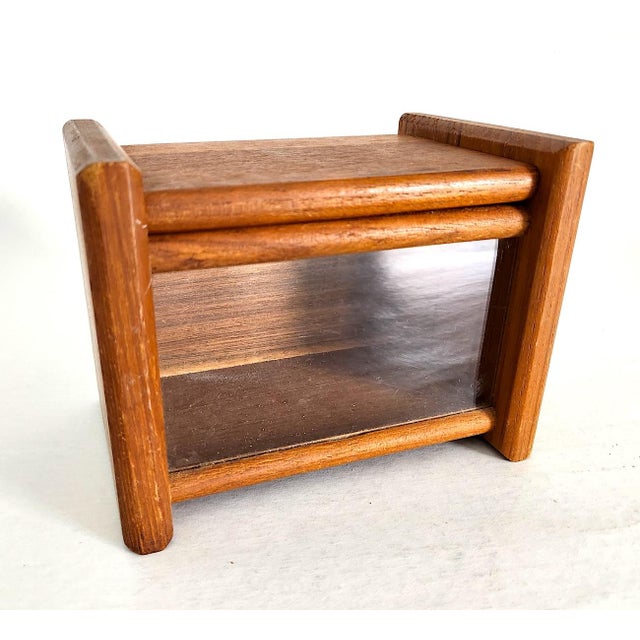 Offered is a charming teak wood flip top box with a glass front panel for easy visibility. Made in Thailand by Dolphin in...