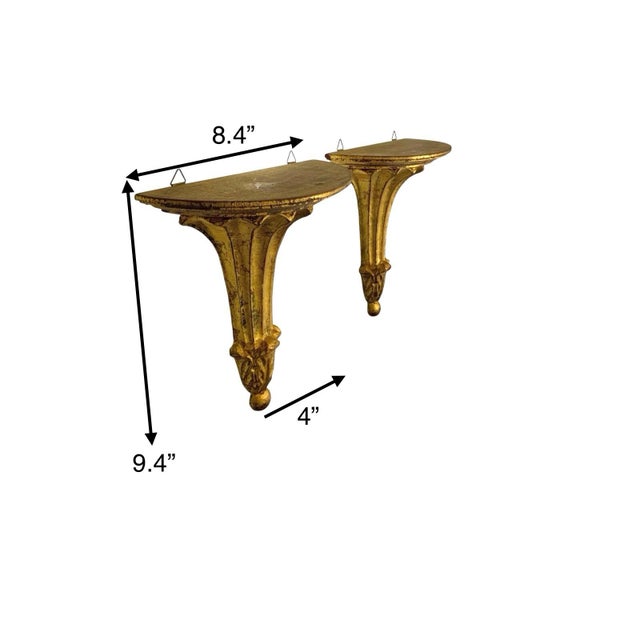 These vintage Florentine style wall shelves are a pair of beautifully crafted decorative pieces in a luxurious gold color....