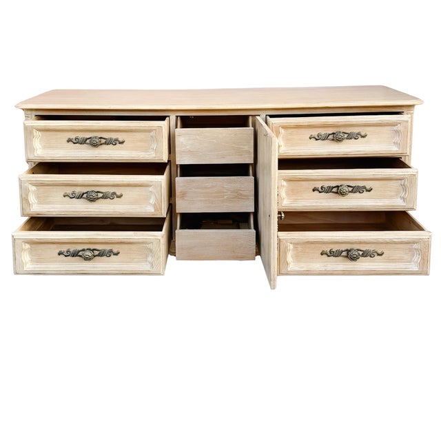 A triple dresser or credenza from Drexel’s Cabernet Collection finished in the sophisticated "Blanc" wash. The finish...