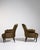 A luxurious pair of Napoleon III armchairs upholstered in velvet, emphasizing comfort and richness. The softly curved...