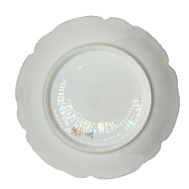 Antique Limoges Porcelain Plates with Ornate Gold Gilding and Intricate Snowflake Medallion Design This breathtaking set...