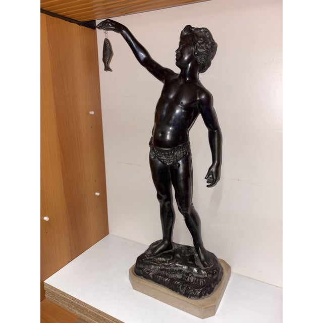 Burnished bronze sculpture by P. UCCELLO NAPOLI depicting the famous subject of the Pescatorello (or young fisherman),...