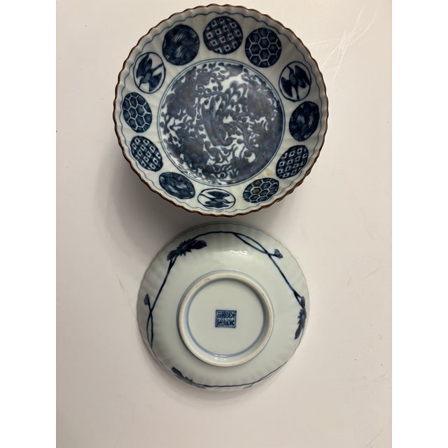 These are International Ching Te Chen salad plates. It features a blue and white design with a central bird (likely a...