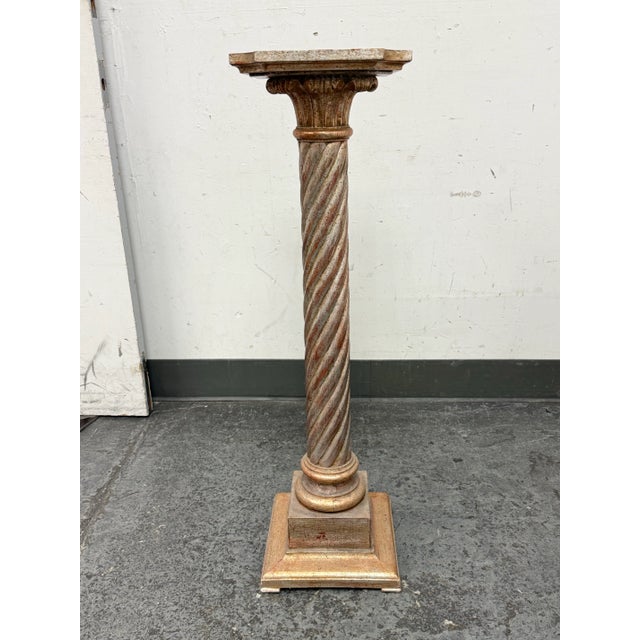 Design Plus Gallery presents a Neoclassical Pedestal of Vintage Age with a Burnished Antique Finish. The pedestal has a...