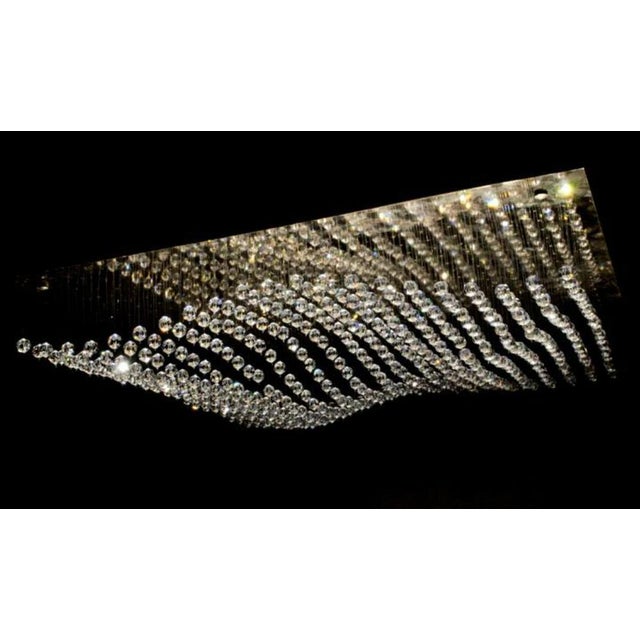 Crystal sea modular pendant led in gold plating and crystal by aggiolight. Dimensions: w 100 x d 100 x h 30 cm. Materials:...