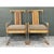 This pair of vintage armchairs joins thick, water-clear Lucite with warm natural rattan in an airy, architectural frame....