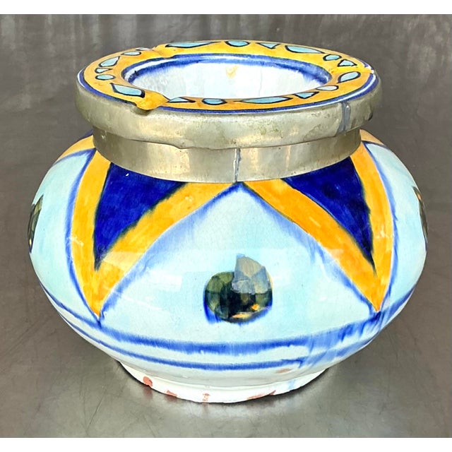 Infuse your space with global charm and artisanal flair with this vintage Boho Moroccan ashtray. Handcrafted in vibrant...