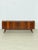 Beautiful, original vintage sideboard in a timeless mid-century design. The piece impresses with its warm wood grain,...