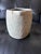 Beautiful hand-carved stone vessel with a substantial, primitive silhouette and naturally weathered surface. The exterior...
