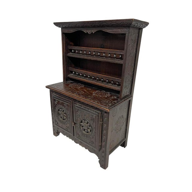 French miniature Breton Doll furniture, ca 1900 Oak wooden set with a hand-carved classic symbols of Breton design,...