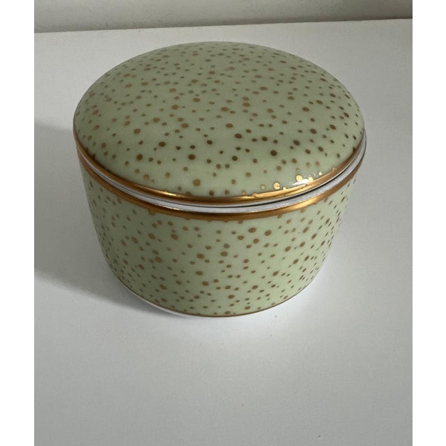 Crafted in France, this exquisite signed Tiffany & Co. Limoges porcelain trinket box features a soft celadon green glaze...