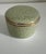 Crafted in France, this exquisite signed Tiffany & Co. Limoges porcelain trinket box features a soft celadon green glaze...