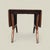 A vintage 1960s drop-leaf dining table by Garrison Furniture Co. featuring a warm wood base and durable laminate top. The...