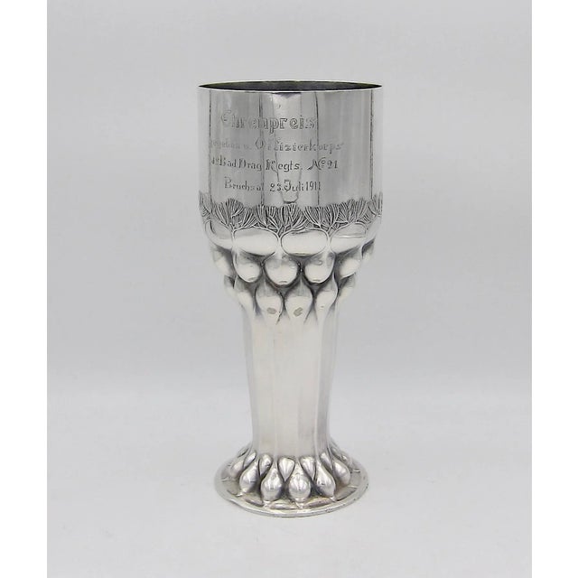 A German Jugendstil / Art Nouveau vase in the shape of a tall, cylindrical beaker on a spreading foot from Orivit AG of...