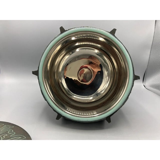 MCM metal ice bucket after James Mont whose designs were largely inspired by Asian motif. Stainless steel liner. This ice...