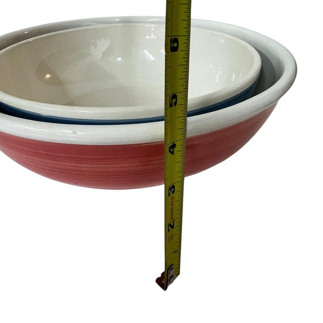 Set of 2 Vintage pasta and salad serving bowls. The striped smaller bowl measures 11” diameter x 4” h. Larger measures 12”...