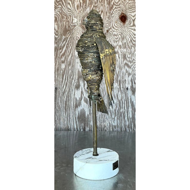 Discover the captivating artistry of H.W. Hauptman with this stunning vintage brass 'Karl Bird' sculpture, a perfect...