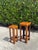 A handsome pair of vintage graduated rattan plant stands featuring geometric stepped tops, tightly wrapped rattan...