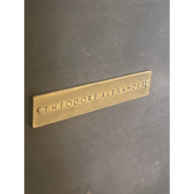 A platinum sycamore bunching table, the square top on offset end supports and a platform base, the interior with burnished...