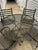 Lovely vintage wrought iron set with table and four chairs. Table has umbrella hole. Table is 47.5 inches in diameter and...